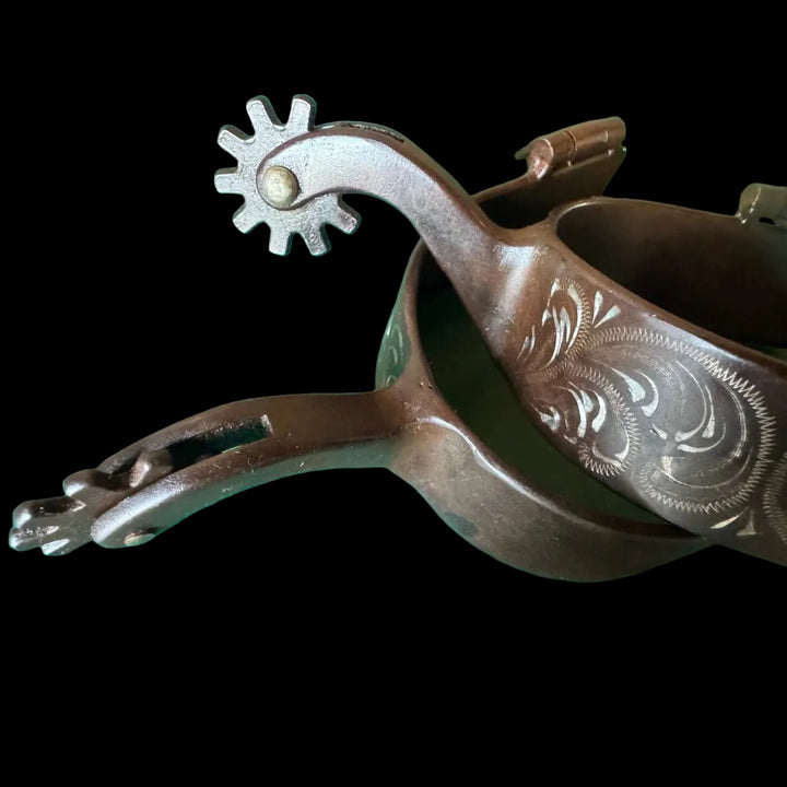 Brown steel spurs with silver flower