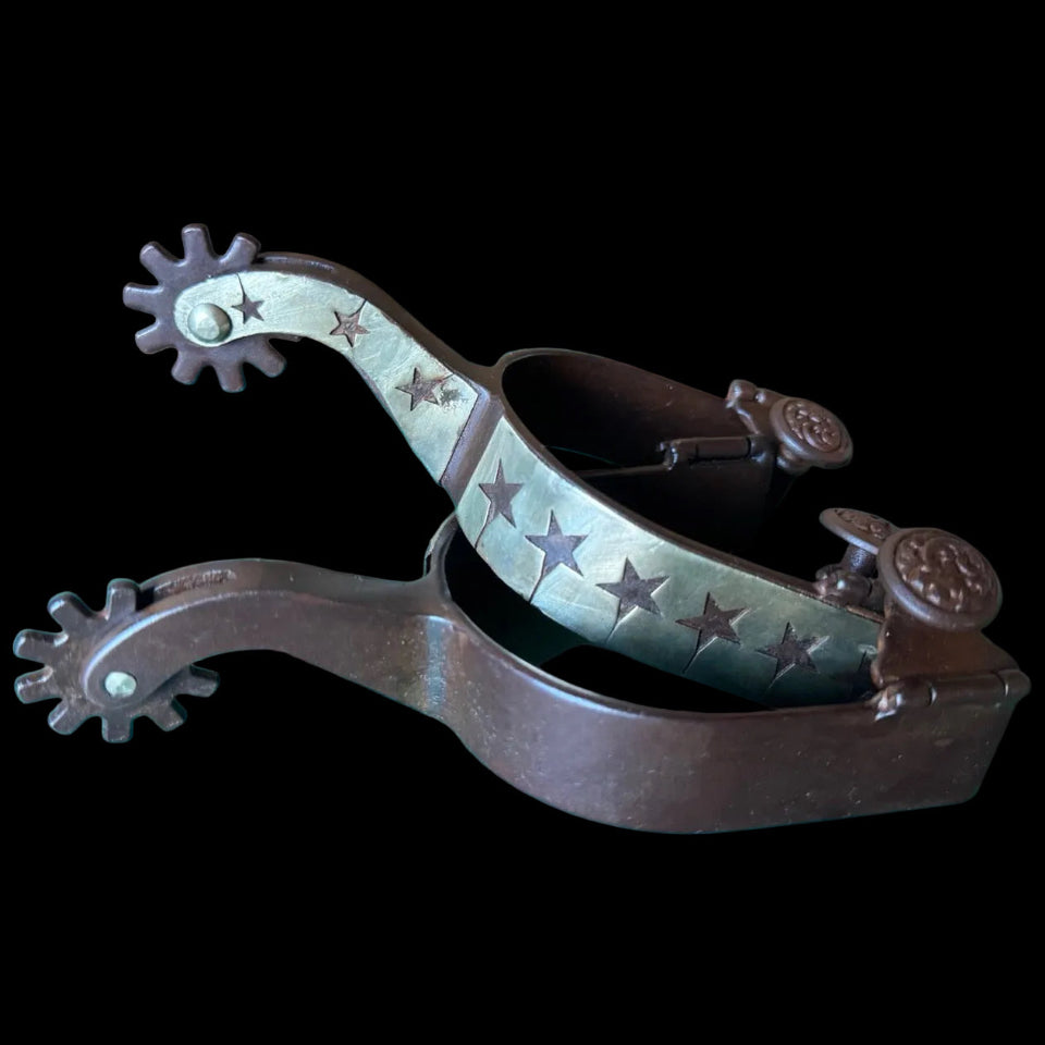 Brown steel spurs with silver stars